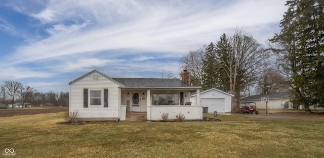 ranch-style home featuring an outbuilding, a chimney, covered porch, a front yard, and a garage