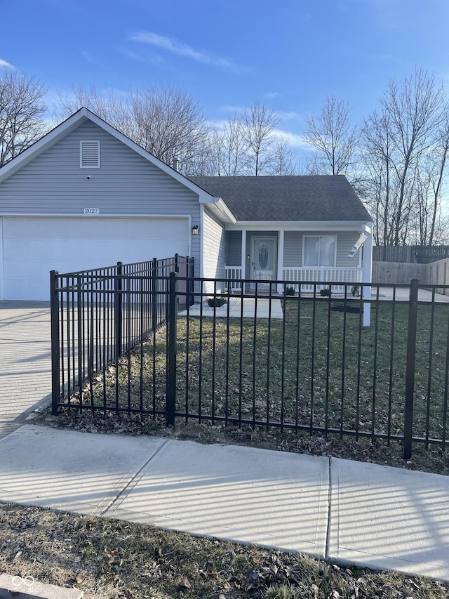 view of front facade featuring a garage, driveway, a fenced front yard, covered porch, and a front lawn