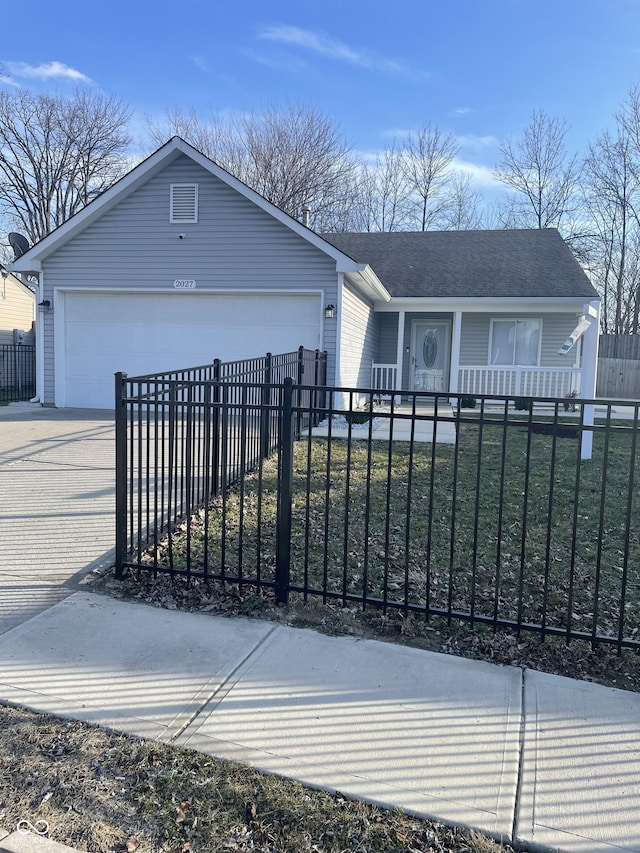 view of front facade featuring a fenced front yard, roof with shingles, a porch, concrete driveway, and a garage