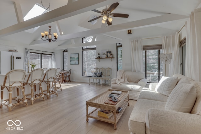 living room with vaulted ceiling with beams, light wood finished floors, and ceiling fan with notable chandelier