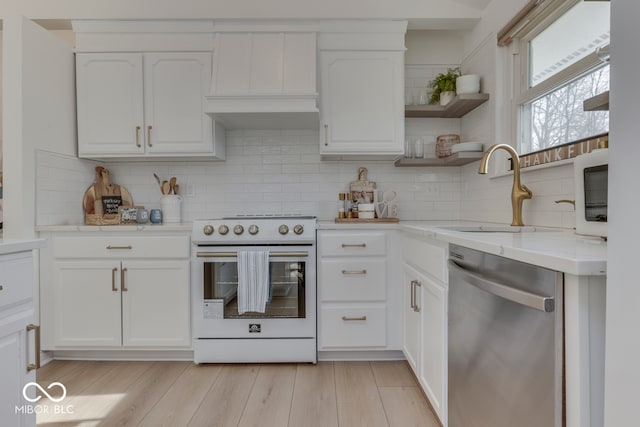 kitchen featuring range with electric stovetop, a sink, white cabinetry, stainless steel dishwasher, and open shelves