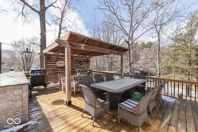 deck featuring outdoor dining area