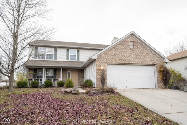 traditional-style house with brick siding, a chimney, covered porch, concrete driveway, and an attached garage