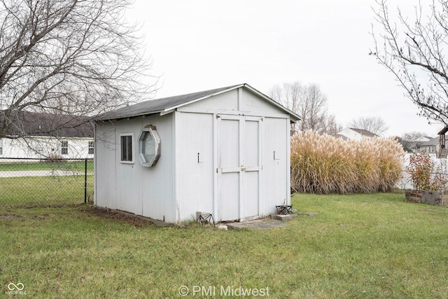 view of shed with fence