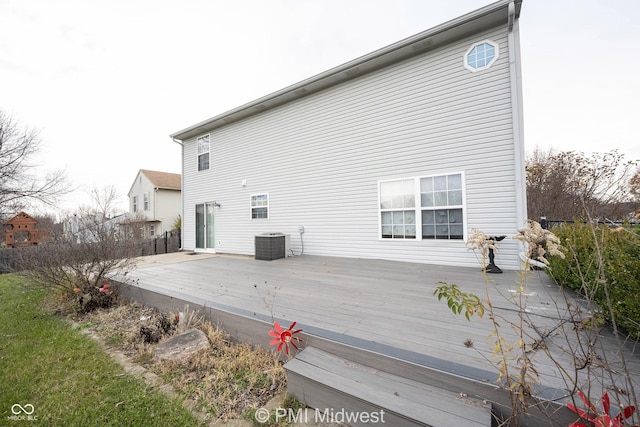 rear view of house with central air condition unit and a wooden deck