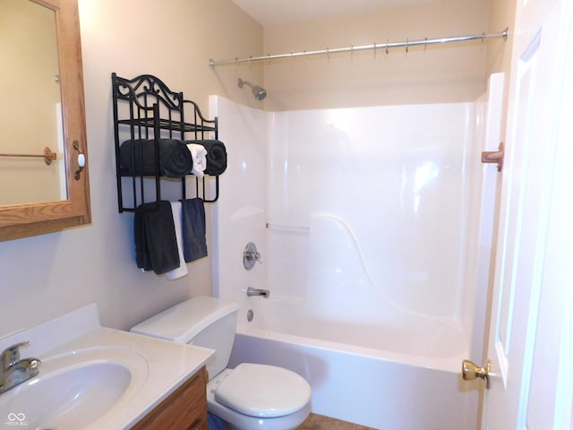 bathroom featuring toilet,  shower combination, and vanity