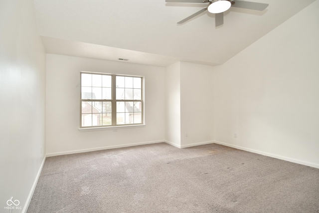 empty room featuring baseboards, visible vents, ceiling fan, and carpet flooring