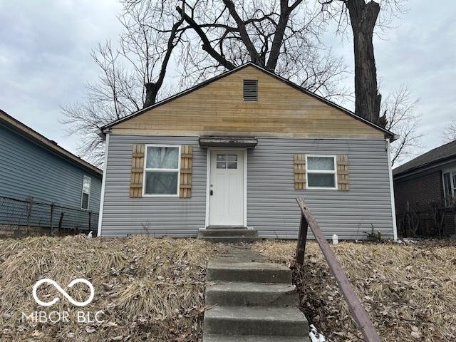 bungalow-style home with entry steps