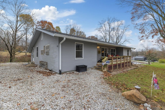 view of front of house featuring a wooden deck