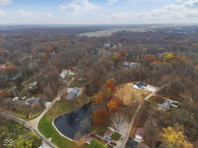 aerial view featuring a water view and a view of trees