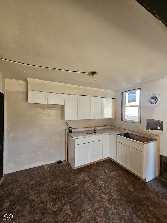 kitchen with visible vents and white cabinetry