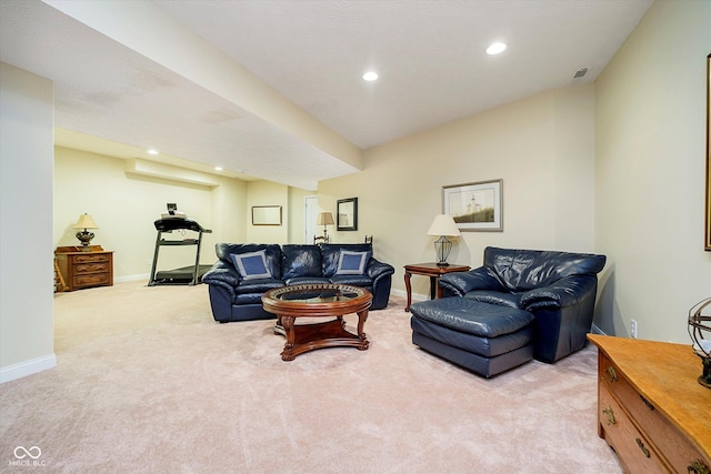 living room featuring recessed lighting, light colored carpet, and baseboards