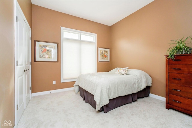 carpeted bedroom with baseboards