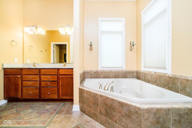 full bathroom with a whirlpool tub, double vanity, a sink, and tile patterned floors