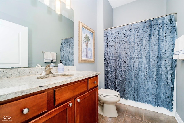 full bath featuring toilet, tile patterned floors, curtained shower, and vanity