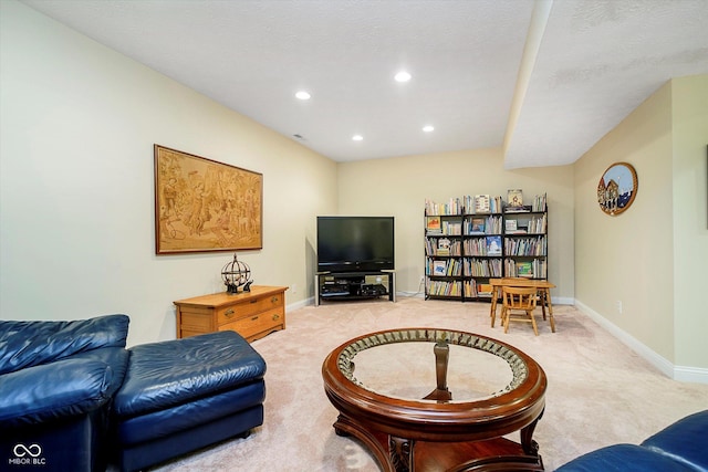 living room featuring light carpet, baseboards, and recessed lighting