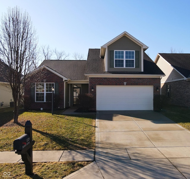 traditional home with an attached garage, driveway, brick siding, and a front yard