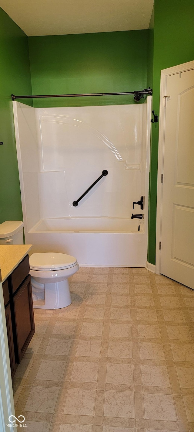 full bath featuring  shower combination, vanity, and toilet