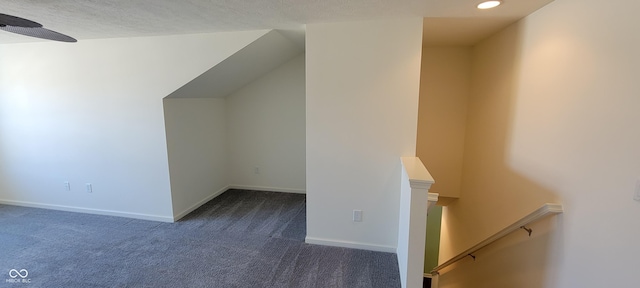 bonus room with lofted ceiling, recessed lighting, dark carpet, and baseboards