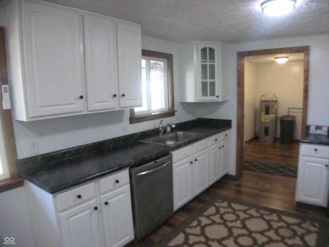 kitchen featuring stainless steel dishwasher, glass insert cabinets, and white cabinetry