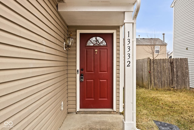 doorway to property with fence