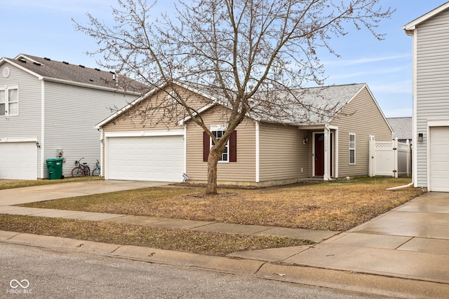 view of front of property with concrete driveway and an attached garage