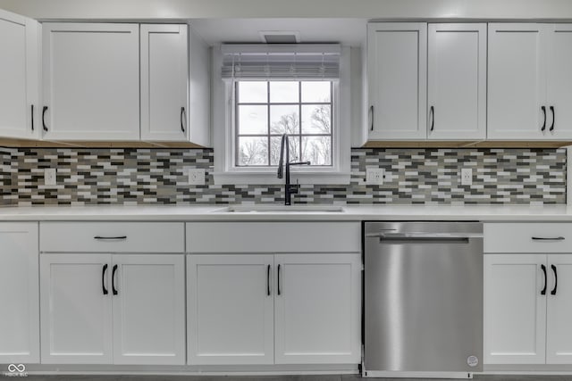 kitchen featuring a sink, white cabinets, dishwasher, and light countertops