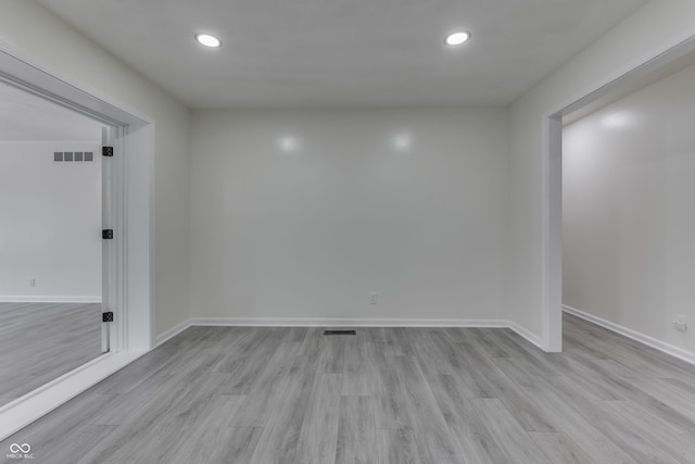 spare room with visible vents, light wood-style flooring, and recessed lighting