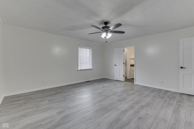 unfurnished room with baseboards, a ceiling fan, crown molding, a textured ceiling, and light wood-type flooring