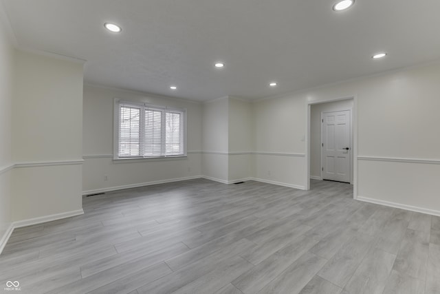 unfurnished room featuring ornamental molding, light wood finished floors, and recessed lighting