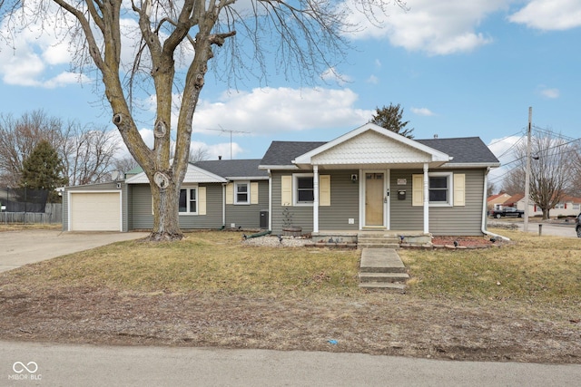 view of front of home featuring a porch, a garage, driveway, roof with shingles, and a front lawn