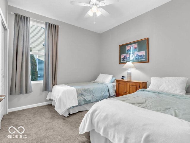 bedroom with baseboards, ceiling fan, and light colored carpet