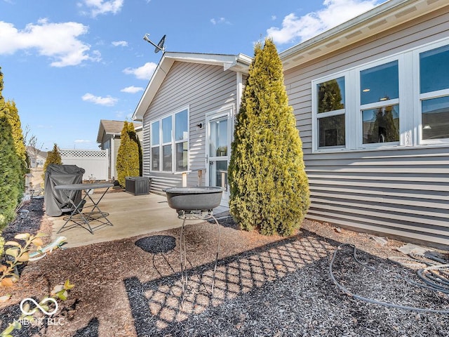 exterior space with a patio area and fence