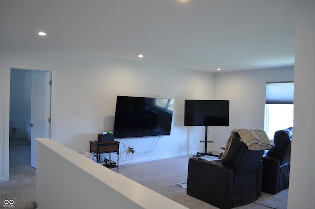 living area with light carpet, baseboards, and recessed lighting