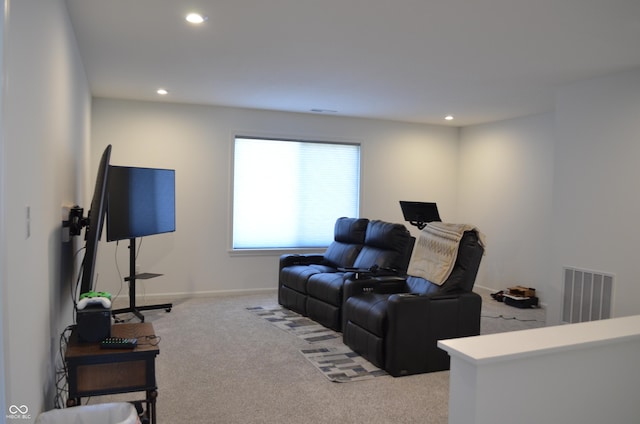 living room with baseboards, recessed lighting, visible vents, and light colored carpet