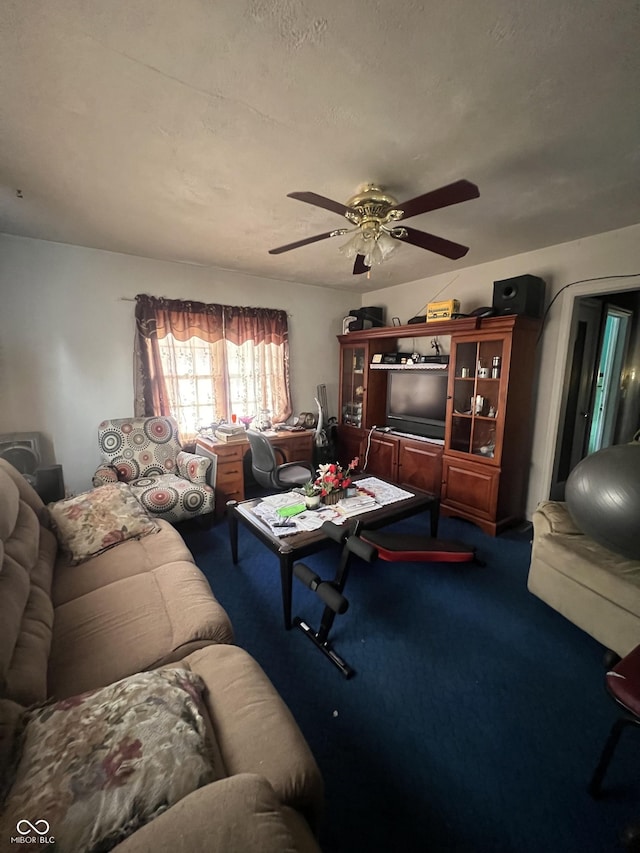 carpeted living area featuring ceiling fan