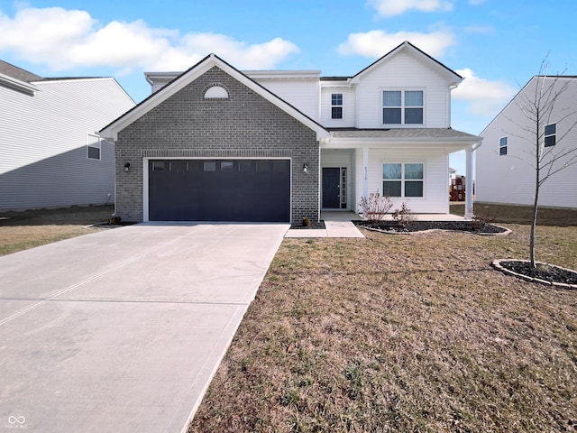 traditional home with a garage, brick siding, driveway, and a front lawn