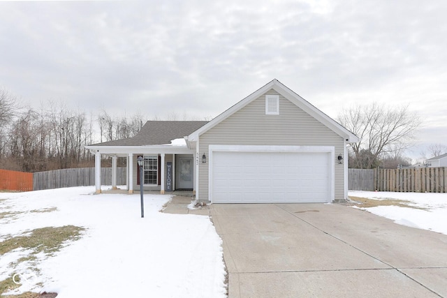 ranch-style home featuring a garage, concrete driveway, and fence