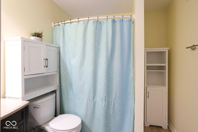 full bath featuring curtained shower, vanity, toilet, and tile patterned floors