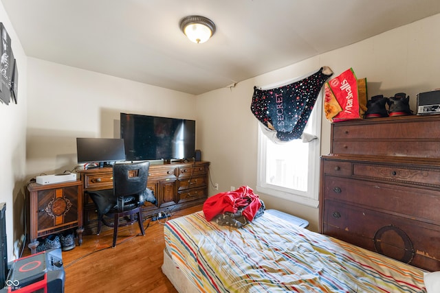 bedroom featuring light wood-style flooring