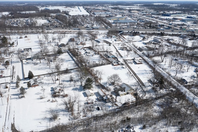 snowy aerial view featuring a residential view