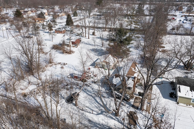 snowy aerial view featuring a residential view