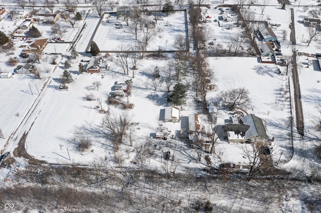 snowy aerial view featuring a residential view