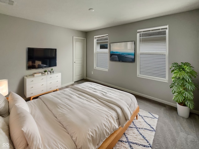 bedroom featuring baseboards