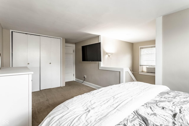 bedroom with a closet, cooling unit, and carpet flooring