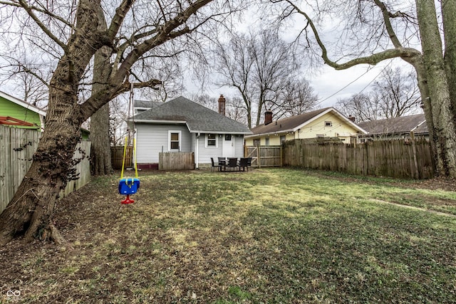 view of yard with a fenced backyard