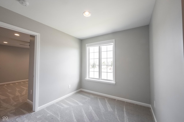 unfurnished bedroom featuring baseboards, carpet flooring, and recessed lighting