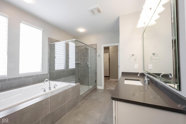 full bathroom with visible vents, a shower stall, vanity, and a bath