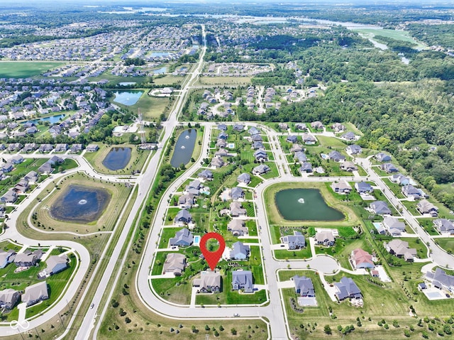 aerial view featuring a residential view and a water view