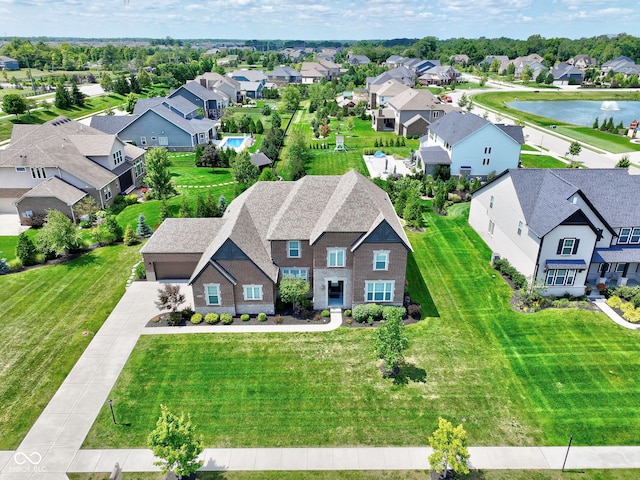 aerial view with a residential view and a water view